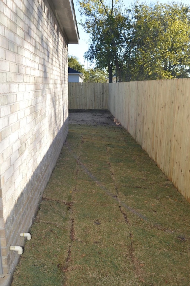 view of yard featuring a fenced backyard