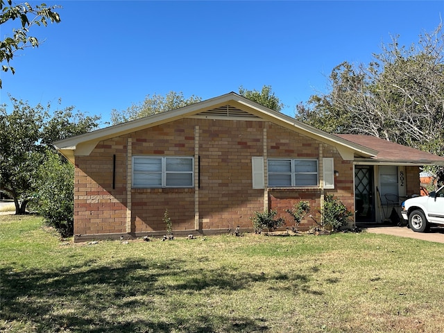 view of property exterior featuring a lawn