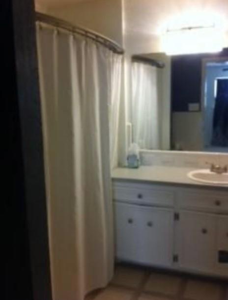 bathroom featuring tile patterned floors and vanity