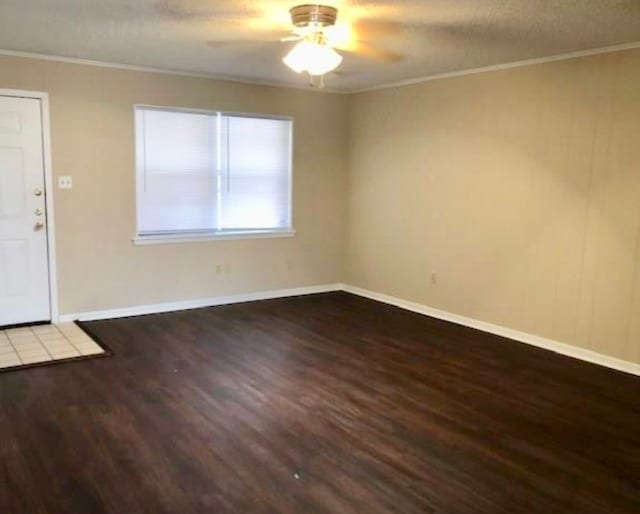 interior space with hardwood / wood-style floors, ceiling fan, and ornamental molding