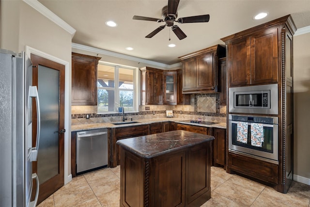 kitchen with sink, tasteful backsplash, a center island, and stainless steel appliances