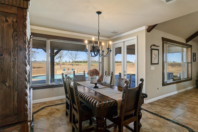 dining area featuring a notable chandelier and ornamental molding