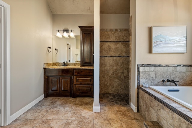 bathroom with vanity and shower with separate bathtub