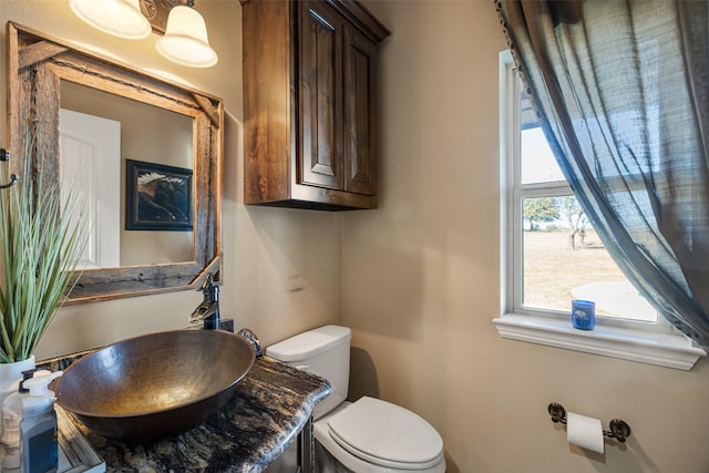 bathroom featuring sink and toilet