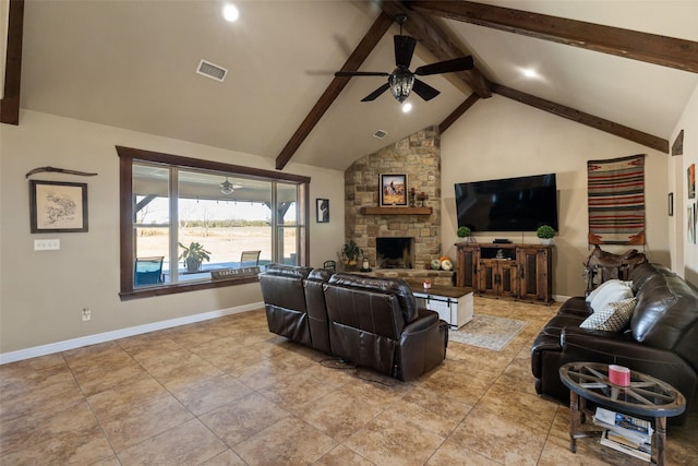 tiled living room with ceiling fan, beamed ceiling, high vaulted ceiling, and a stone fireplace