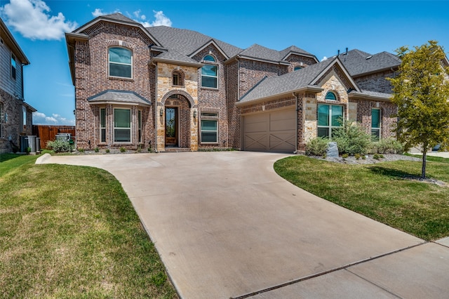 view of front of house featuring a front yard and a garage