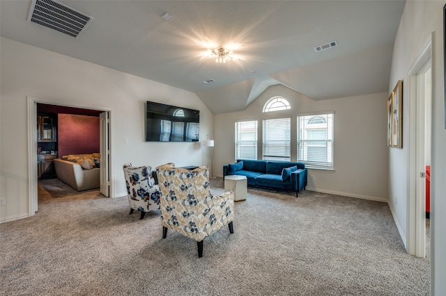 living room featuring light colored carpet and lofted ceiling