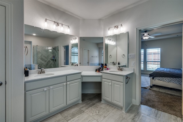 bathroom featuring vanity, ceiling fan, and a shower with shower door