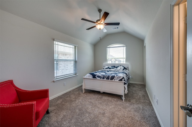 carpeted bedroom with vaulted ceiling and ceiling fan