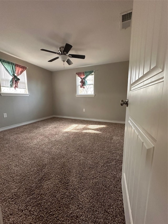 unfurnished room with carpet and ceiling fan