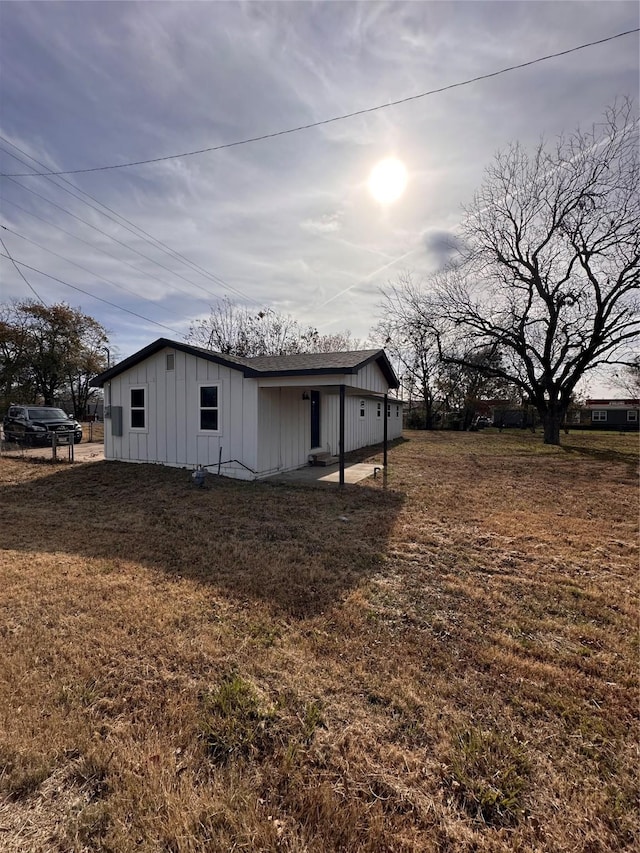 view of property exterior with a yard