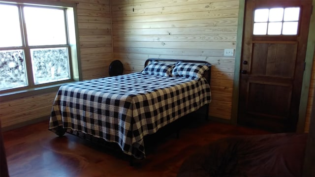 bedroom with wooden walls