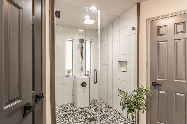 bathroom with a shower with shower door