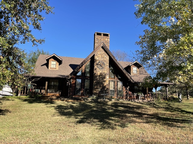 back of house featuring a yard