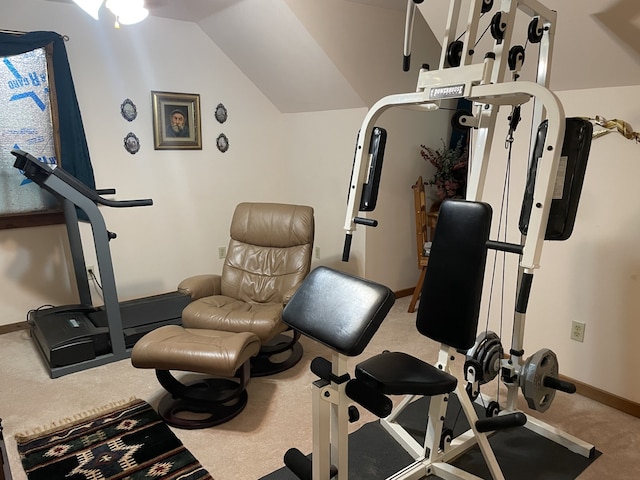 workout area featuring carpet and vaulted ceiling