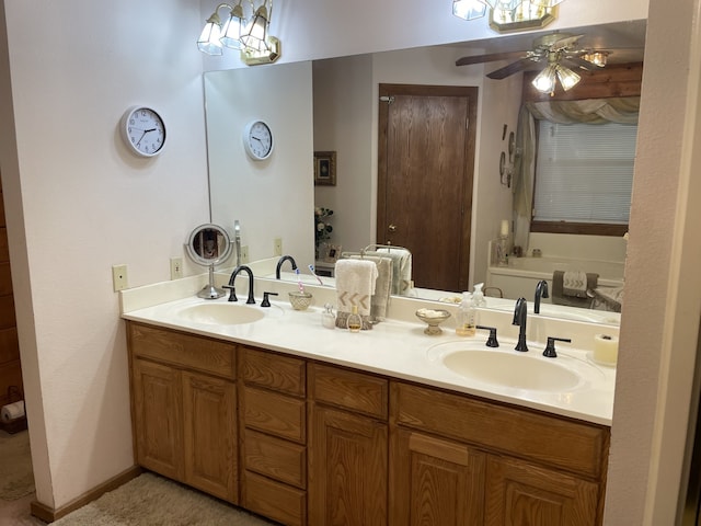 bathroom featuring vanity, ceiling fan, and a bath