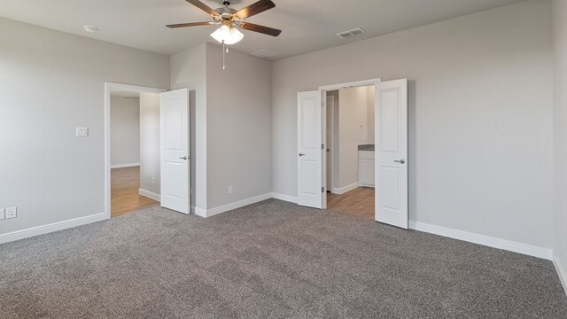 unfurnished bedroom with carpet flooring and ceiling fan