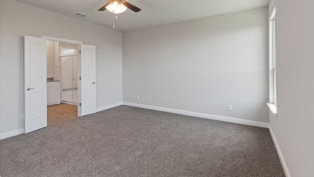 unfurnished bedroom with ceiling fan and carpet floors