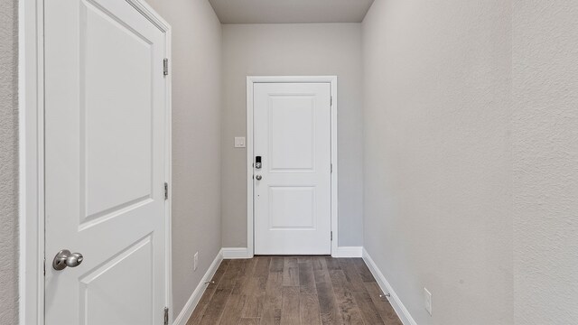 doorway to outside with dark hardwood / wood-style floors