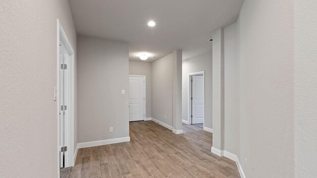 corridor featuring light hardwood / wood-style floors