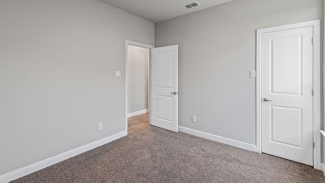 unfurnished bedroom with carpet