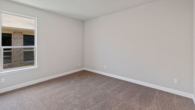 empty room with carpet flooring