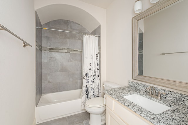 full bathroom featuring tile patterned floors, shower / tub combo with curtain, vanity, and toilet