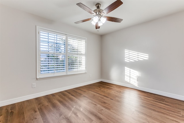 spare room featuring ceiling fan and wood-type flooring