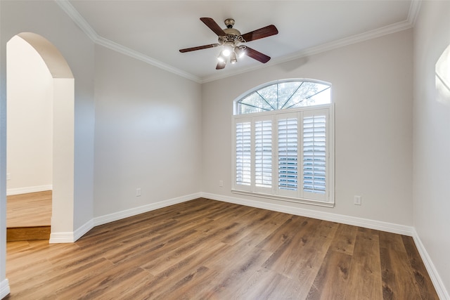 spare room with hardwood / wood-style flooring, ceiling fan, and ornamental molding