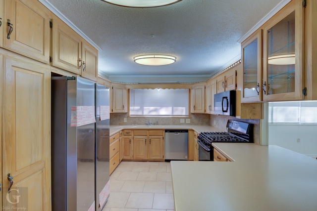 kitchen featuring appliances with stainless steel finishes, light brown cabinetry, decorative backsplash, kitchen peninsula, and a textured ceiling