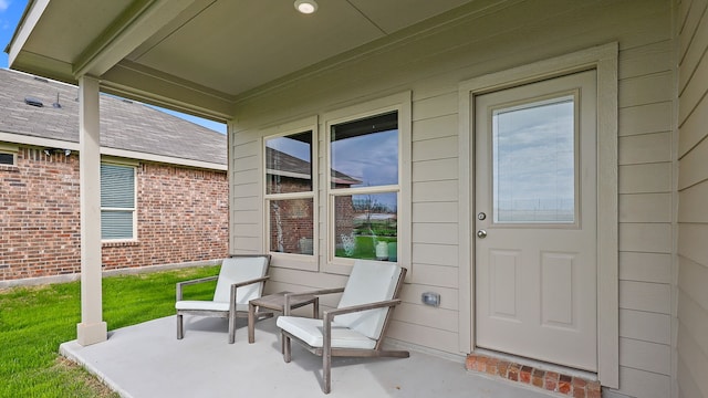 doorway to property with a patio