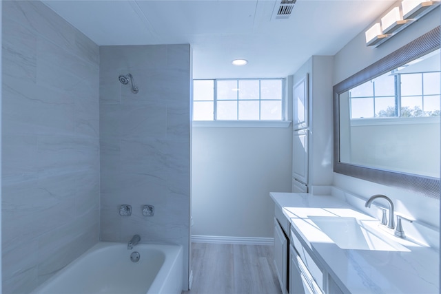 bathroom featuring vanity and hardwood / wood-style flooring