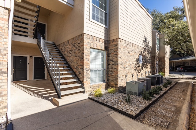 view of property exterior with central AC