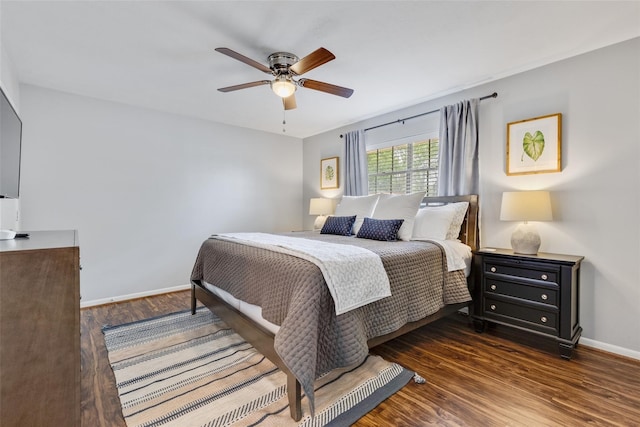 bedroom featuring ceiling fan and dark wood-type flooring