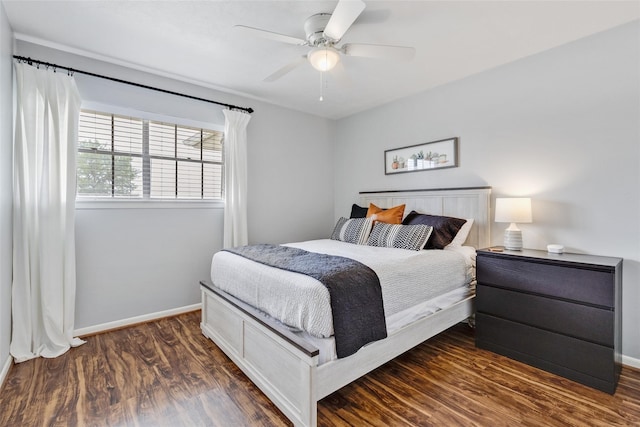 bedroom featuring ceiling fan and dark hardwood / wood-style flooring