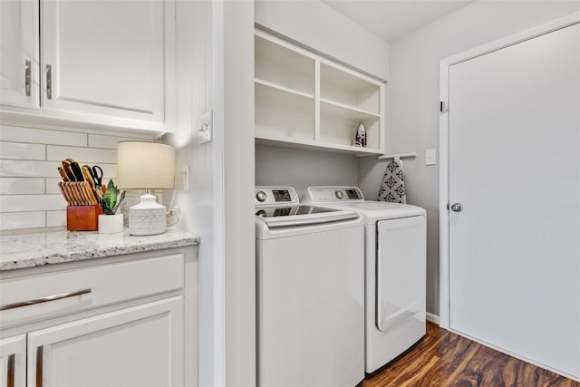 washroom with washer and dryer and dark hardwood / wood-style floors