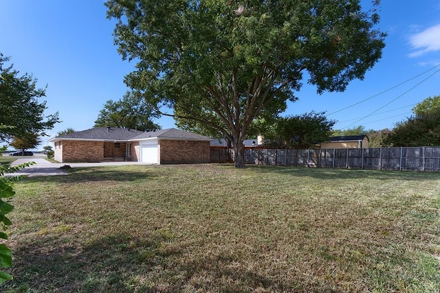 view of yard featuring a garage