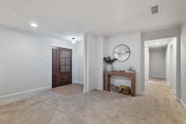 entryway featuring crown molding and light carpet