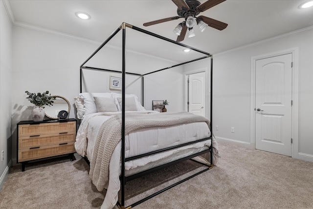 bedroom featuring ceiling fan, crown molding, and carpet