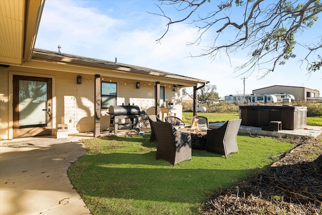 view of yard with a patio area and a hot tub