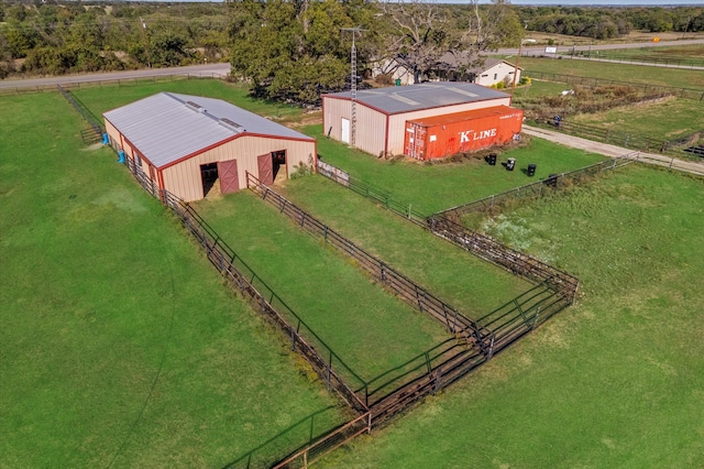 birds eye view of property with a rural view