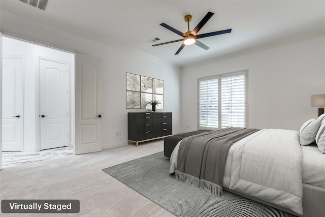 bedroom featuring ceiling fan, crown molding, and light carpet