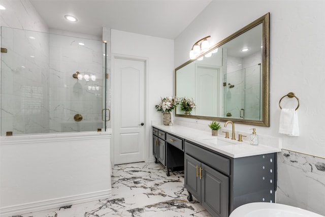 bathroom featuring vanity and a shower with shower door