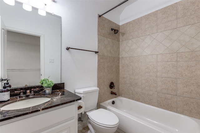 full bathroom featuring vanity, toilet, and tiled shower / bath