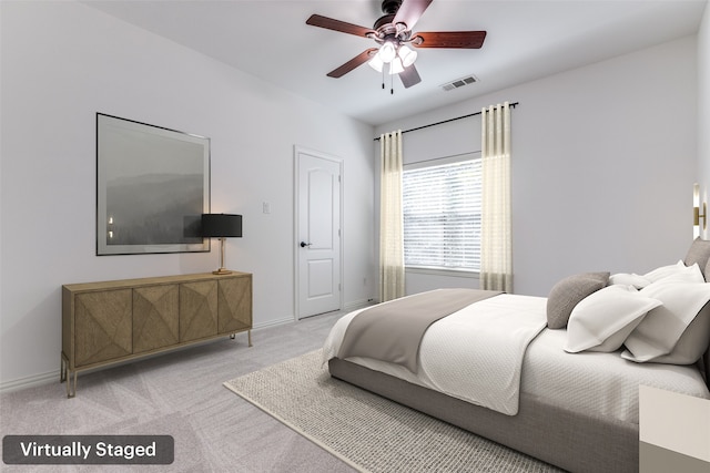 bedroom featuring ceiling fan and light colored carpet