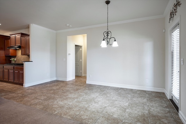 unfurnished dining area with crown molding and a notable chandelier