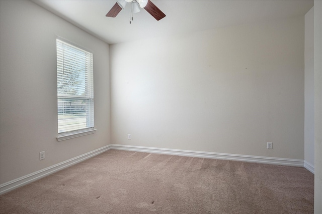 empty room with carpet and ceiling fan