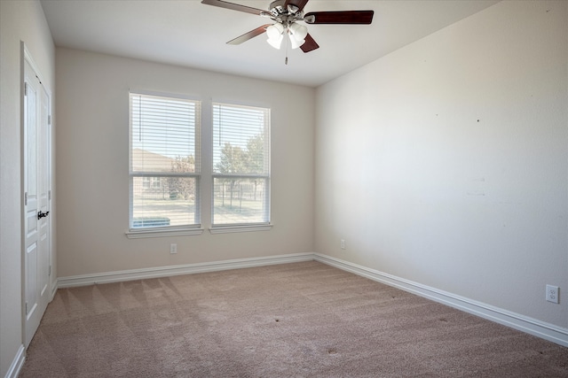 carpeted empty room with ceiling fan