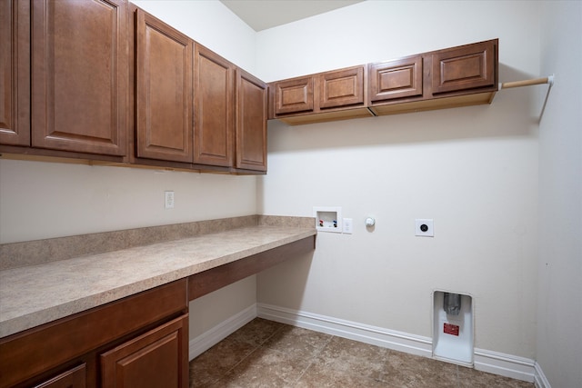 laundry room with gas dryer hookup, cabinets, washer hookup, and hookup for an electric dryer