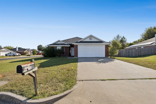 single story home featuring a front lawn and a garage